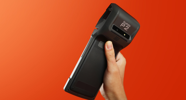 Hand holding the POS terminal device
